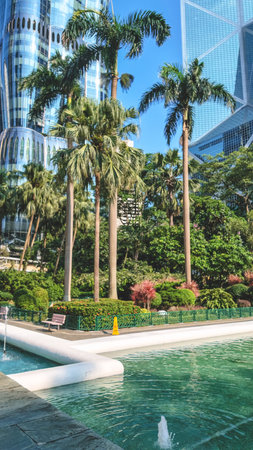 Aug 7 2026 Hong Kong The Henderson framed by palm trees in Central