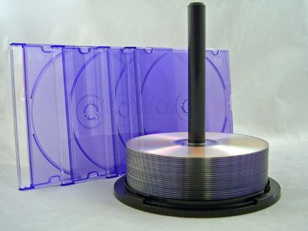 cds on spindle with purple cd cases