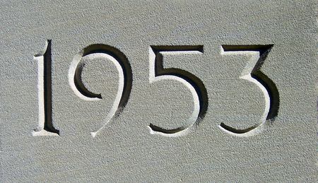 date 1953 engraved in a gray cement  wallの写真素材