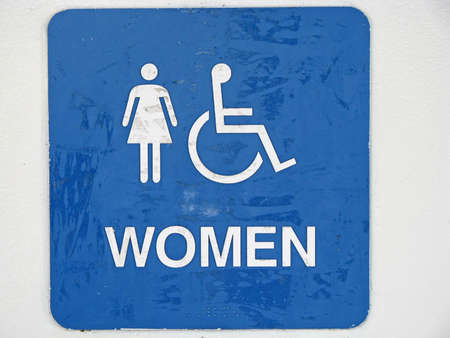 old restroom sign with women handicap charactersの写真素材