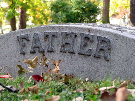 autumn cemetery grave headstone marked fatherの写真素材
