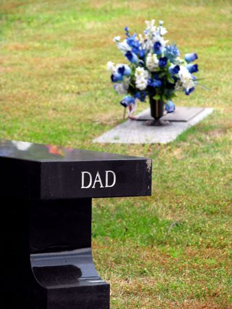 cemetery grave tombstone engraved with word dadの写真素材