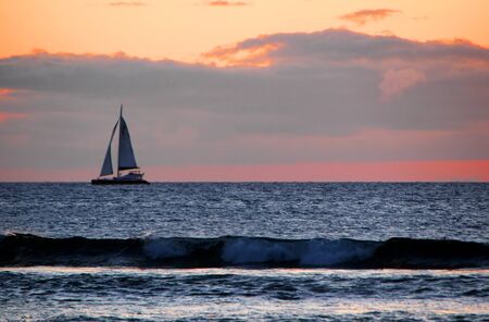 Sailboat at Sunset Maui Hawaiian Island Oceanの写真素材