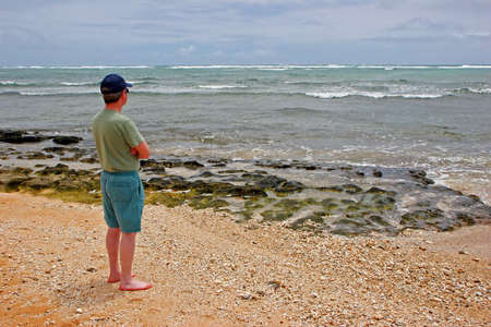 Caucasian Adult Male on Kauai Hawaii Beachの写真素材