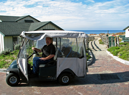 MONTEREY BAY BEACH, CA - NOVEMBER 15:  Man in Golf Cart at the Sanctuary Beach Resort  2012のeditorial素材
