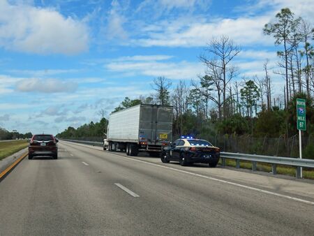 I-75 FLORIDA, FL - NOVEMBER 24:  Florida State Trooper Pulling over Semi Truck on Northbound I-75...