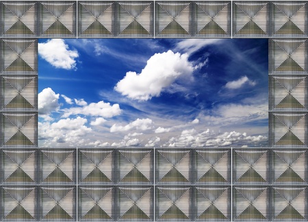 glass block wall  with blue skyの写真素材