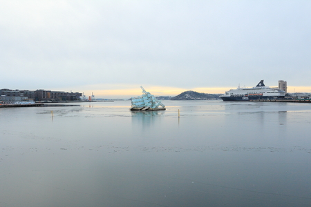 Oslo, Norway - December 30, 2018: She Lies, sculpture floating in the ocean water next to the Opera House of Oslo, Norway.のeditorial素材