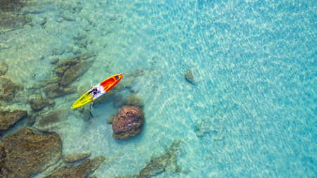 Aerial view of a kayak in the blue sea .Woman kayaking She does water sports activities.の写真素材