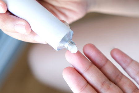 The woman's hand, she uses steroids Apply External typeの写真素材