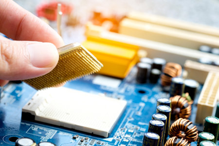 Hand of computer engineering brings computer cpu processor memory change components into socket processor for maintenance.Technology and development conceptの写真素材