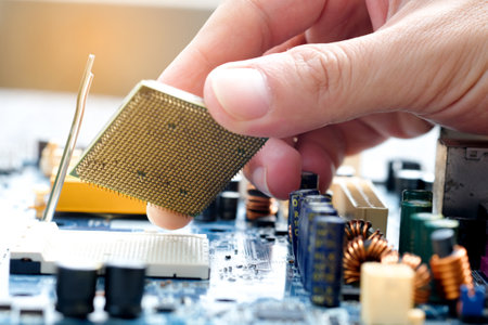 Hand of computer engineering brings computer cpu processor memory change components into socket...