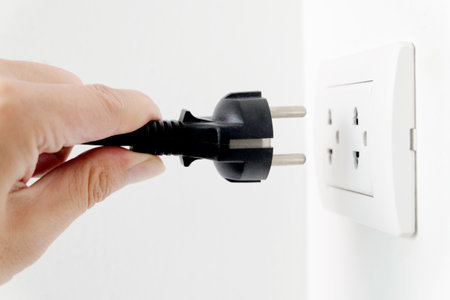 Hand of Electrical Appliances He was pulling the plug. Out of the plug. In his office during work...