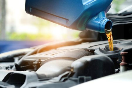 Refueling and pouring oil quality into the engine motor car Transmission and Maintenance Gear .Energy fuel concept.の写真素材