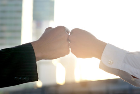 Hand of people fist Bump assemble corporate Meeting Teamwork and harmonious Symbolの写真素材