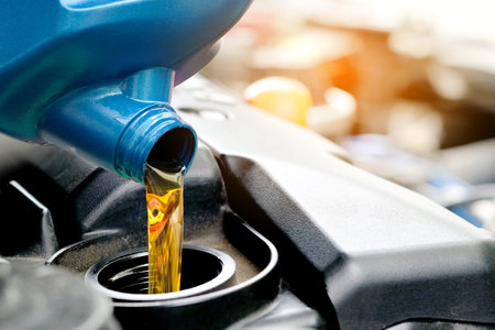 Refueling and pouring oil quality into the engine motor car Transmission and Maintenance Gear .Energy fuel concept.の写真素材