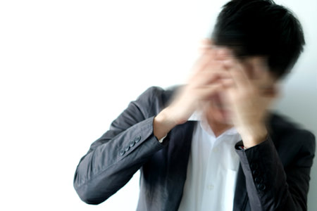 businessmen have an angry headache as two emotions. White background, health concept.Motion picturesの写真素材