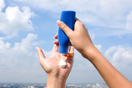 sunscreen, beach, cream, vacation, apply, back, background, body, bottle, burn, cancer, care, concept, cosmetic, dermatology, factor, female, hands, holiday, leisure, lotion, moisturizer, outdoor, person, protection, ray, relax, screen, sea, season, skin, skincare, sky, spf, summer, sun, sunbathing, sunblock, suntan, tan, tanning, travel, trip, tube, uv, wellness, woman, health care, Skin health, Sun protection;の写真素材