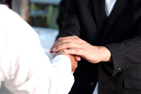 Holding hands with business partners to trust business partners, relationships to achieve future...