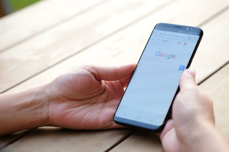 January 21, 2018 Bangkok, Thailand Women use mobile internet application facebook on smartphone Facebook is social networking service.She uses the internet to get information of the world.のeditorial素材