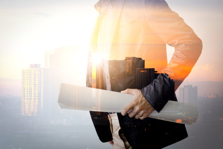 double exposure image of an engineer people is working and controlling the construction he hold  a plan production.concept of modern life, businessの写真素材