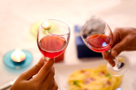 Hand of group friends celebrate successfully with red wine in the party. Young toasting in party and drinking after work hard for relax and be enjoy. Celebration Concept , Cheers!の写真素材