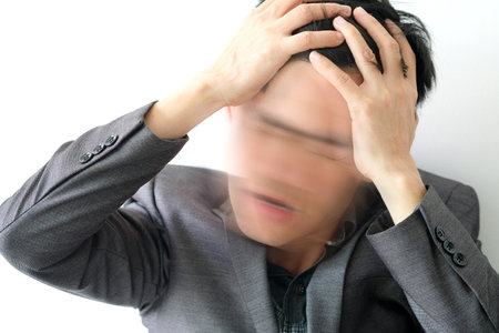 businessmen have an angry headache as two emotions. White background, health concept.Motion picturesの写真素材