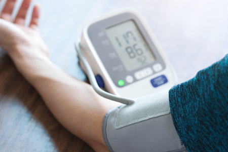 Man check blood pressure monitor and heart rate monitor with digital pressure gauge. Health care and Medical conceptの写真素材