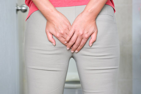 Man's hand, he holds a roll of toilet paper Going to the bathroom Toilet toilet backgroundの写真素材
