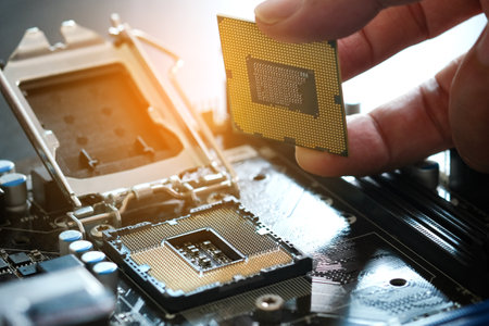 Hand of computer engineering brings computer cpu processor memory change components into socket...