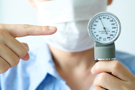 Man check blood pressure monitor and heart rate monitor with digital pressure gauge. Health care and Medical conceptの写真素材