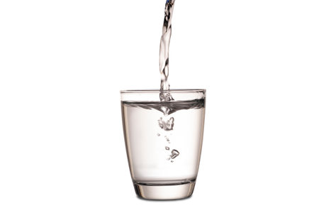 Clean water for good health. Pouring Fresh Pure Water From Pitcher Into A Glass. Health And Diet Concept. Lifestyle Healthcare And Beauty.の写真素材