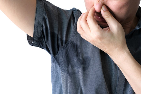 Men wear white sleeves, arms are covered with armpits, Sweat are unclean and unclean. Health care conceptの写真素材