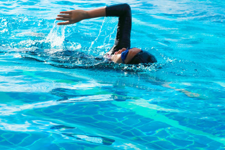Women swim in a freestyle swimming style that is standard swimming.の写真素材