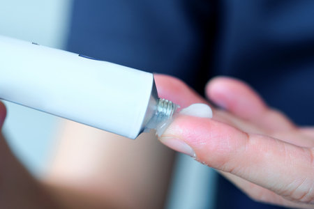 The man's hand, he uses steroids Apply External typeの写真素材