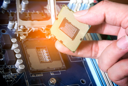 Hand of computer engineering brings computer cpu processor memory change components into socket processor for maintenance.Technology and development conceptの写真素材