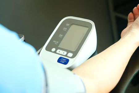 Man check blood pressure monitor and heart rate monitor with digital pressure gauge. Health care and...