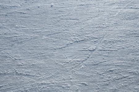 Ice skating rink, cutting ice, snow. Winter sport. Scratches on the surface of the ice. Close-up photo. High quality photoの写真素材