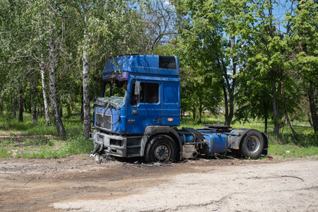 KHARKIV, UKRAINE - May, 04, 2022: Burned and broken car. War in Ukraine 2022. Russian missiles in Kharkiv Ukraine. Russian aggression, conflict. Russian attack on Ukraine. Russia is bombing Ukraineのeditorial素材