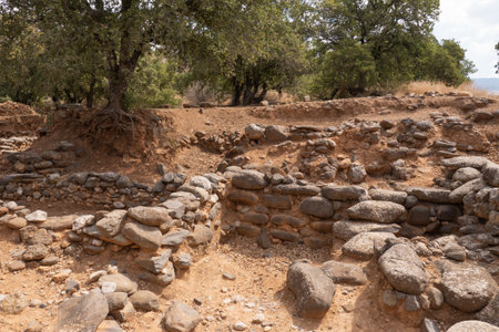 Stone ruins of a historic ancient city in Israel. Old dirt road