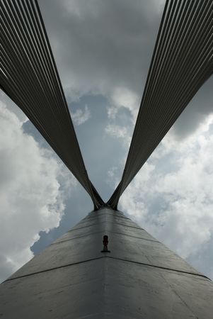 Modern Architctural style bridge abstracts angainst a cloudy skyの写真素材