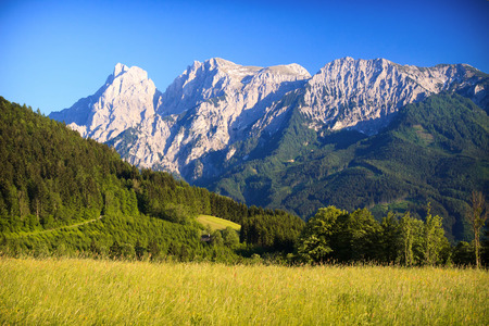 Sunny Alps valley in early sunsetの写真素材