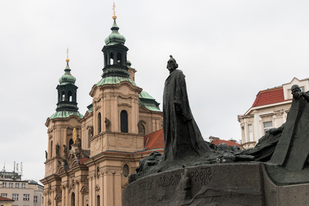 Jan Hus monument and at the background  St. Nikolaus Kircheの写真素材