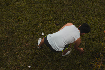 Man playing golf on the grass in the park. See from above.の写真素材