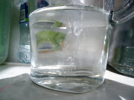 Water filter in a glass of water. Cleaning the house.の写真素材