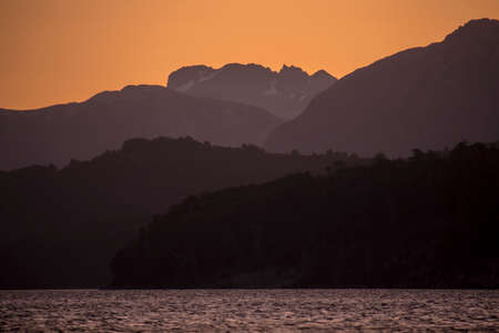 Different shades of Andes Mountains in the last moments of the afternoon. Nahuel Huapi Lake in Nahuel Huapi National Park. Patagonia Argentinaの写真素材