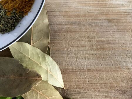 Laurel And Spices Top View. Mediterranean Wooden Food Table. Copyspace Vegetable Table.の写真素材