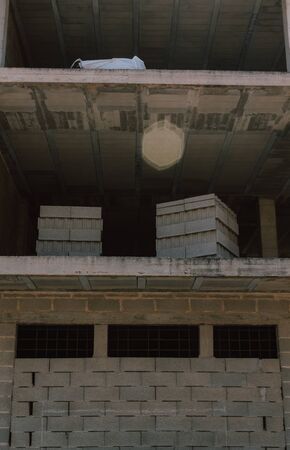 Work in full construction. Building in growth process. Space enabled for construction, ensuring the foundations.の写真素材