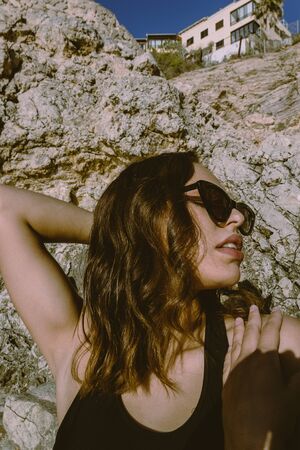 Portrait of young hipster woman with sunglasses enjoying summer. Autumn is approaching with good...