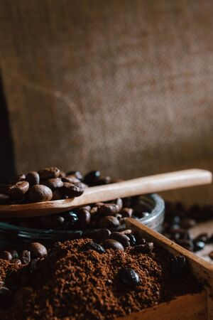 still life with coffee beans and old coffee mill on the rustic backgroundの写真素材